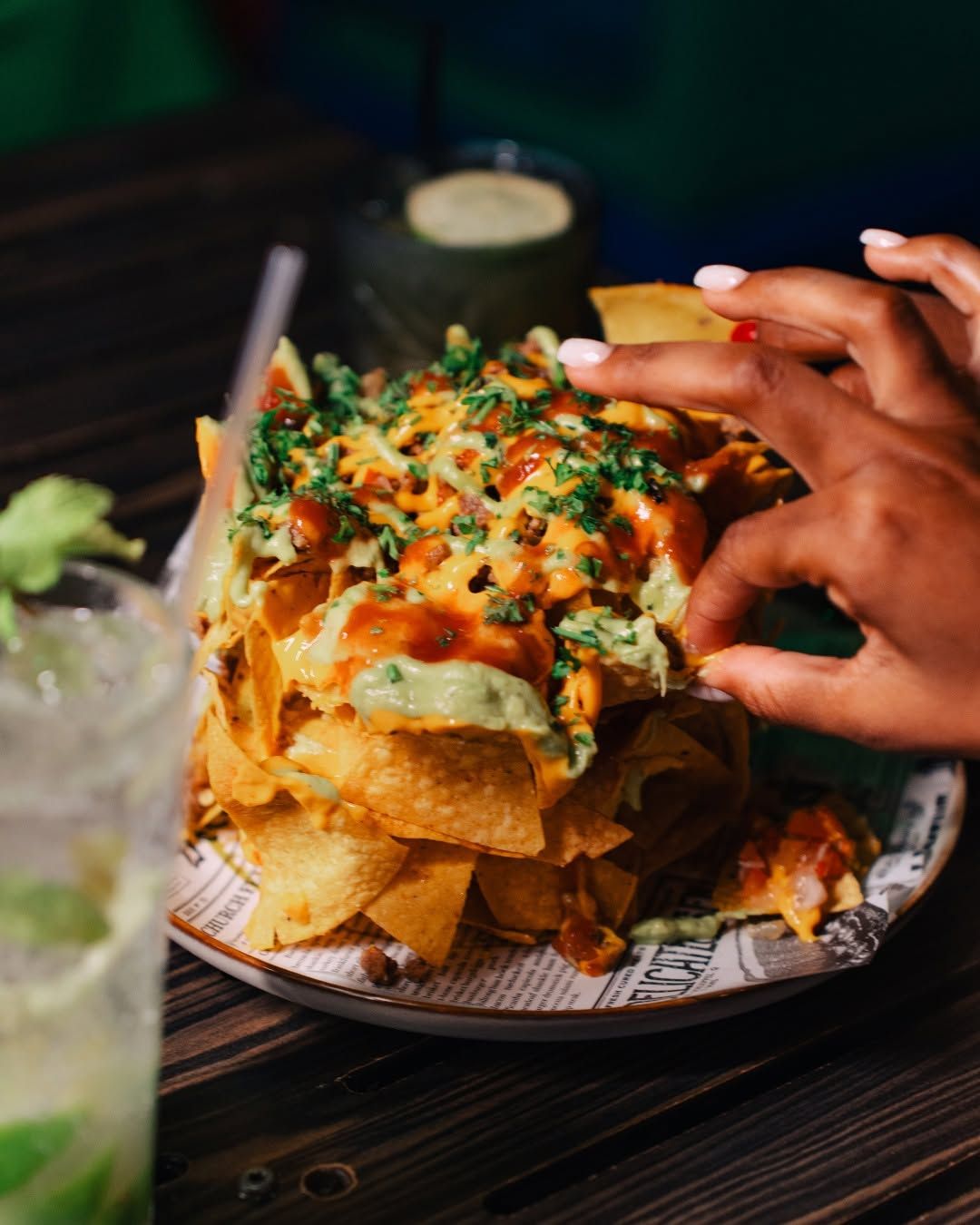 Loaded nachos with cheese, guacamole and salsa